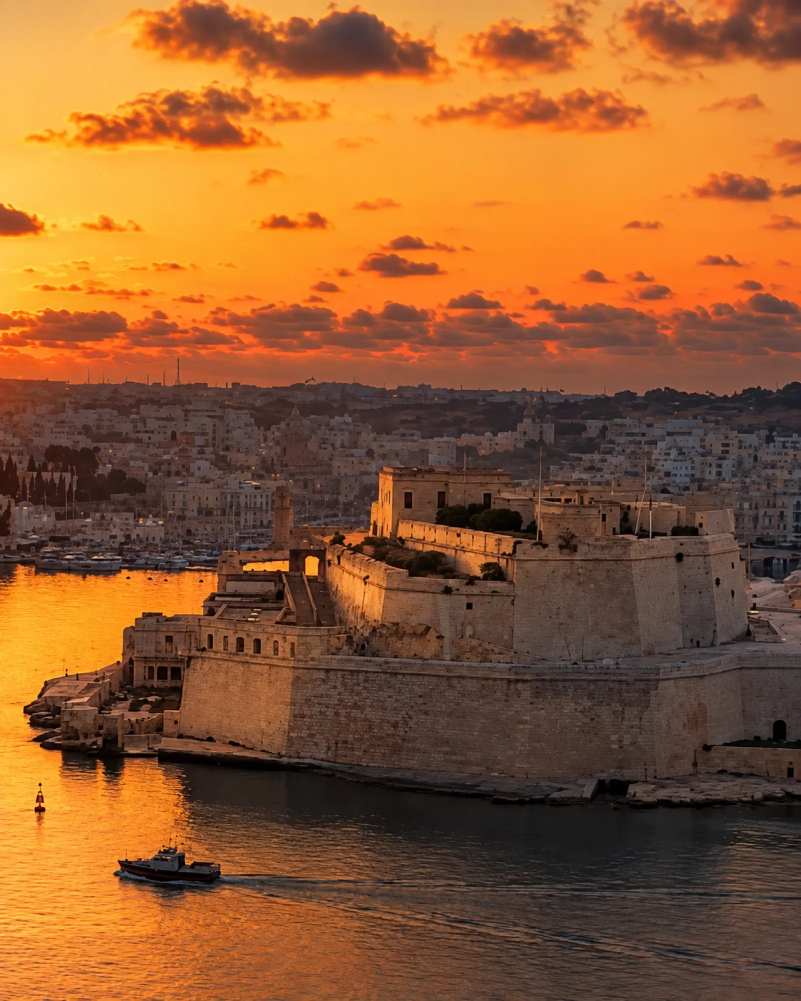 Fort St Angelo across the Grand Harbour at sunset